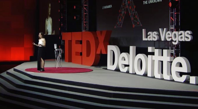 Jen Kramer speaking on the TEDx Deloitte Las Vegas stage